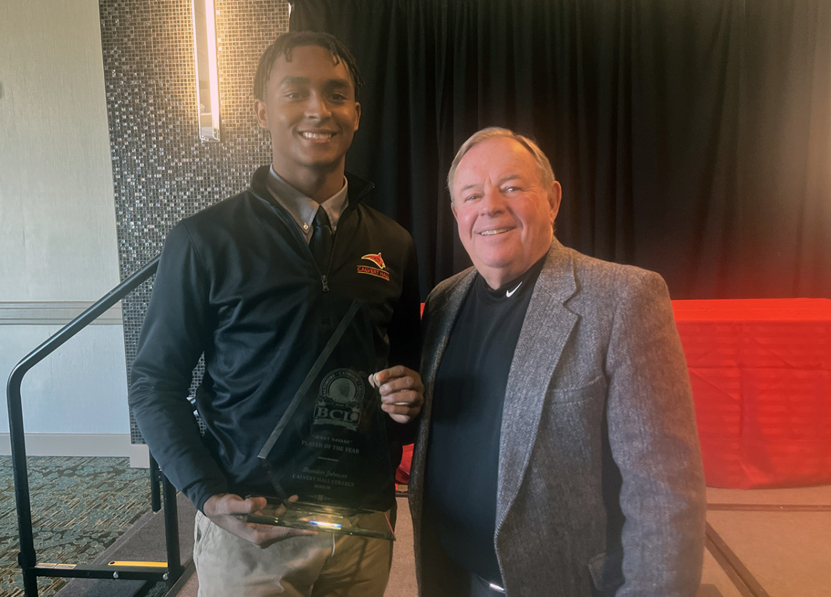 Calvert Hall's Brendan Johnson showcases his 2024 BCL Player of the Year award while posing with BCL Commissioner Jack Degele.